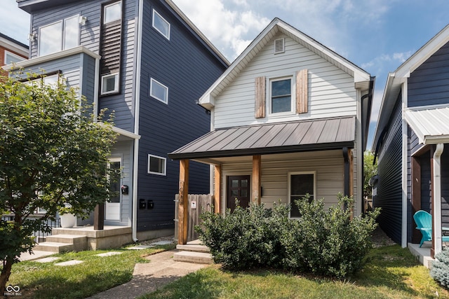 1456 Fletcher Ave, Indianapolis, IN 46203 - view of front facade with covered porch, a standing seam roof, and a metal roof