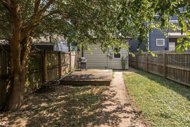 1456 Fletcher Ave, Indianapolis, IN 46203 - fenced backyard featuring a deck and an outdoor structure
