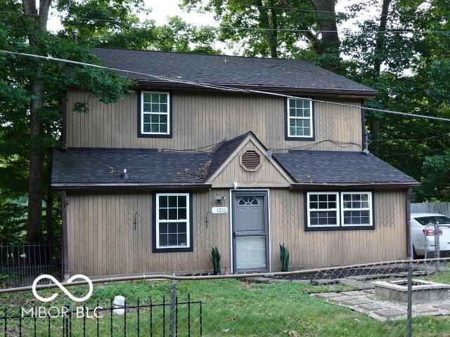 view of front of house with a shingled roof