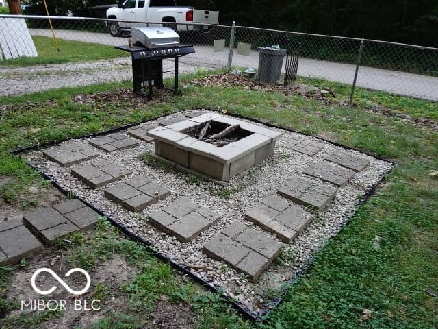 view of yard with a fire pit