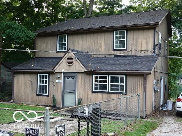 view of front facade with a shingled roof