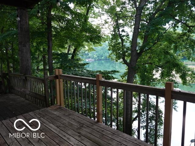 wooden deck featuring a water view