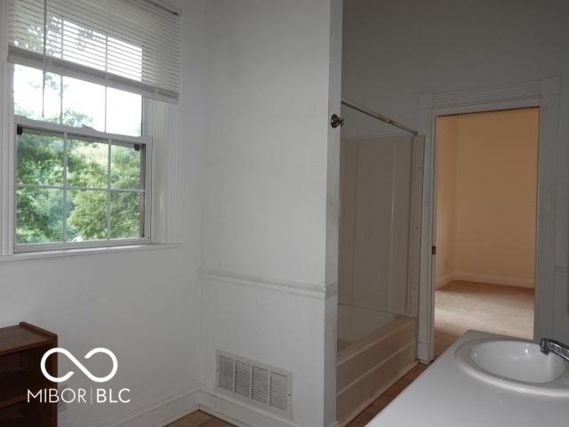 bathroom featuring vanity and shower / washtub combination
