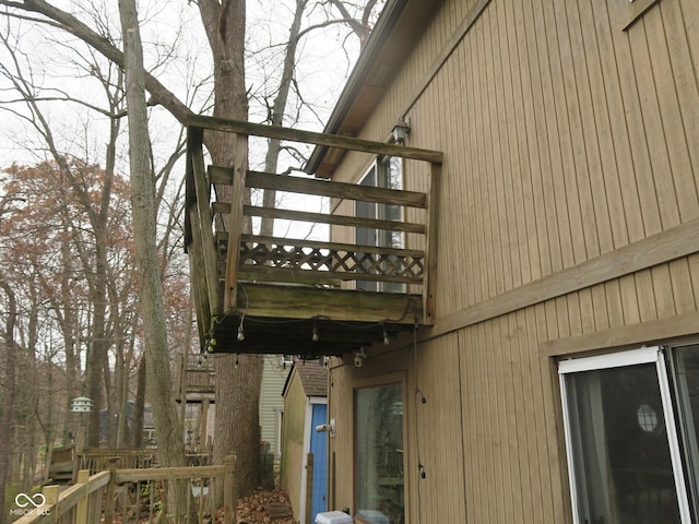 view of side of home featuring a balcony