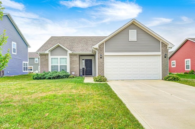 1270 W Limestone Way, Fortville, IN 46040 - view of front of house with brick siding, driveway, a front lawn, an attached garage, and roof with shingles