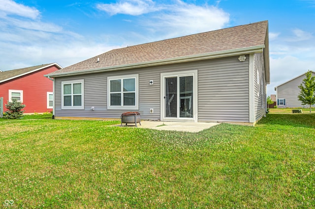 1270 W Limestone Way, Fortville, IN 46040 - rear view of property featuring a lawn, a patio, and an outdoor fire pit