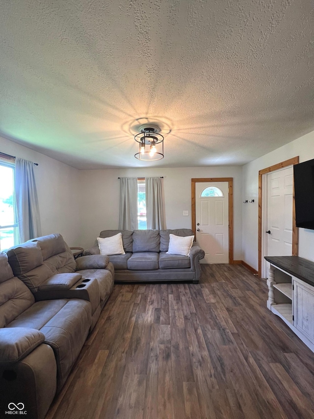 1203 S 6th St, Clinton, IN 47842 - living room with dark wood-type flooring and a textured ceiling