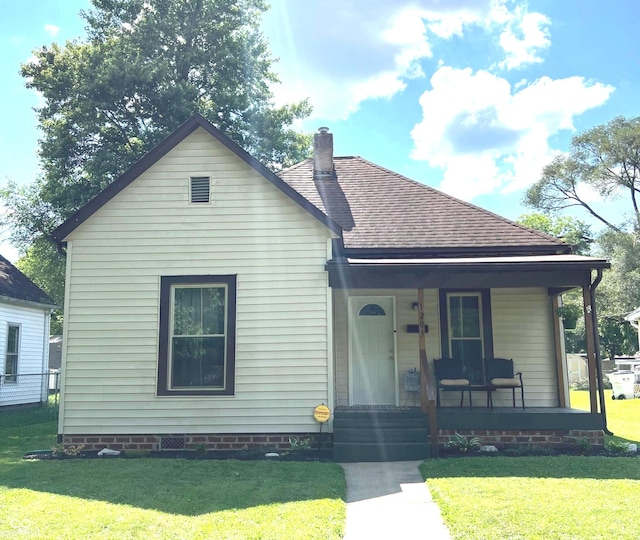 1203 S 6th St, Clinton, IN 47842 - view of front of house featuring covered porch, roof with shingles, a front yard, and a chimney