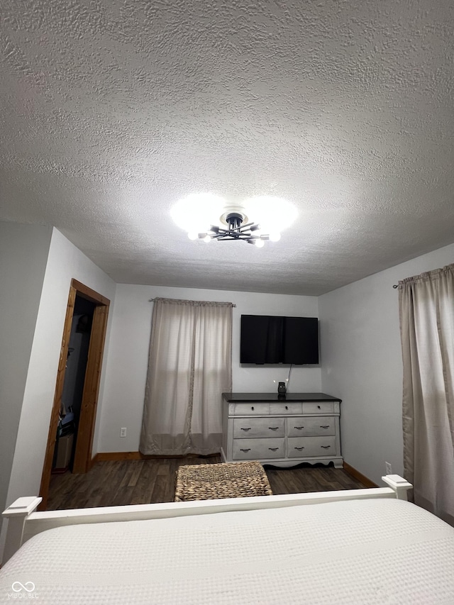 1203 S 6th St, Clinton, IN 47842 - bedroom with wood finished floors and a textured ceiling