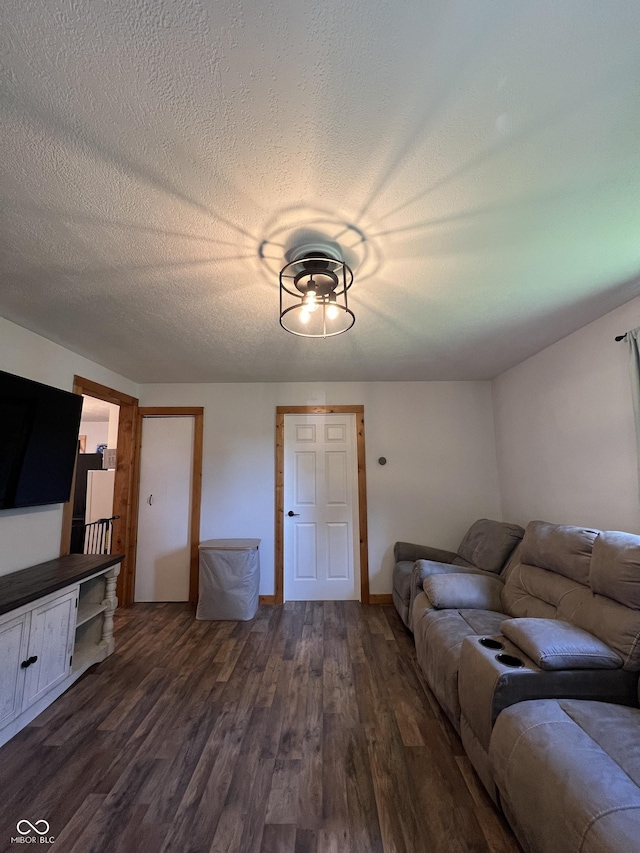 1203 S 6th St, Clinton, IN 47842 - living area with dark wood-style floors and a textured ceiling