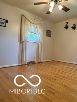 4680 Cartersburg Rd, Plainfield, IN 46168 - spare room featuring wood finished floors and ceiling fan