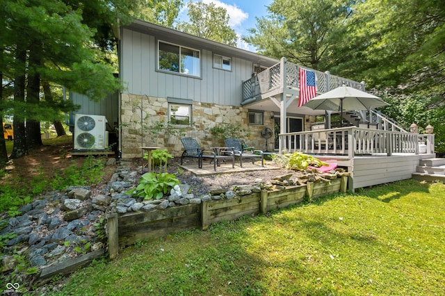 6254 Grosbeak Ct, Nineveh, IN 46164 - rear view of property with stone siding, a balcony, a yard, a patio, and board and batten siding