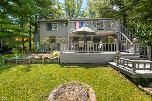 6254 Grosbeak Ct, Nineveh, IN 46164 - rear view of property featuring stone siding, a wooden deck, and a lawn
