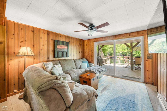 6254 Grosbeak Ct, Nineveh, IN 46164 - living room featuring wood walls and a ceiling fan