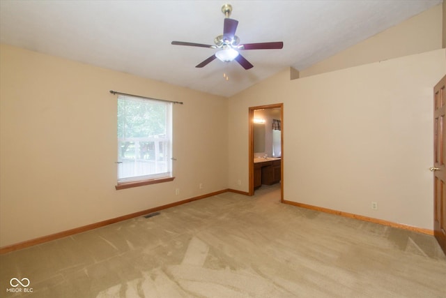 4625 Pine Park Ln, Indianapolis, IN 46268 - spare room featuring lofted ceiling, light carpet, and a ceiling fan
