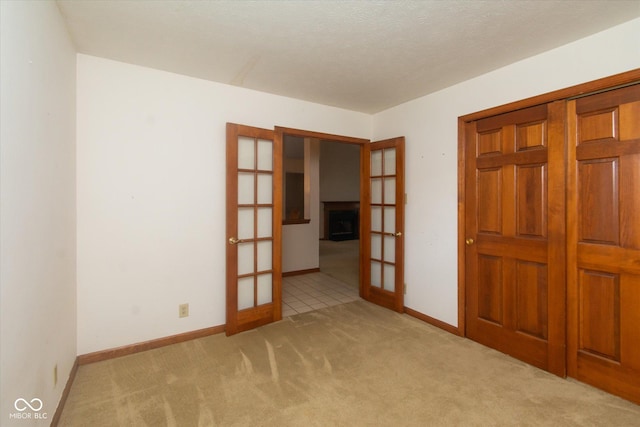4625 Pine Park Ln, Indianapolis, IN 46268 - empty room featuring french doors and carpet flooring