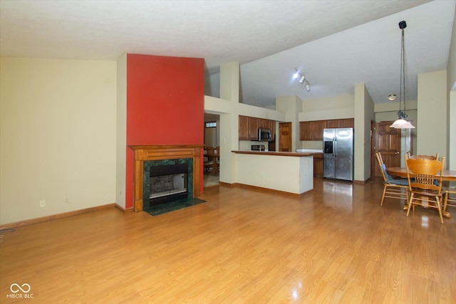 4625 Pine Park Ln, Indianapolis, IN 46268 - living room featuring light wood-type flooring, a fireplace, and high vaulted ceiling