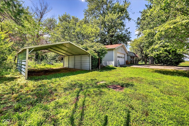5508 S State Rd 59, Clay City, IN 47841 - view of green lawn featuring driveway and a garage