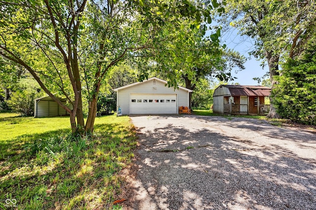 5508 S State Rd 59, Clay City, IN 47841 - view of front of house with an outbuilding, a detached garage, and a front yard