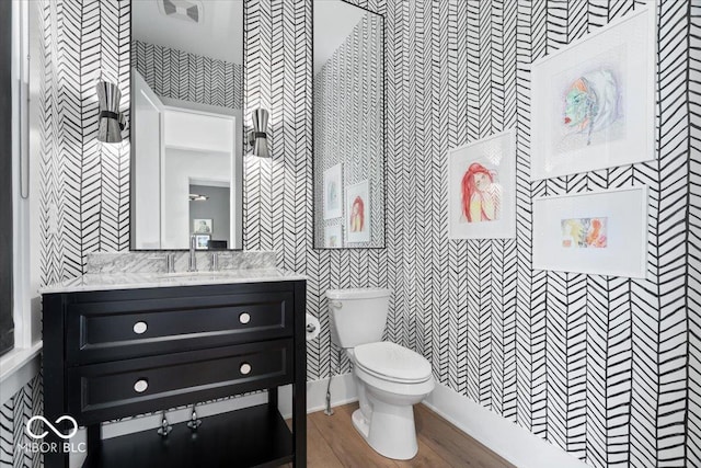 20440 Chatham Hills Blvd, Westfield, IN 46074 - bathroom with wallpapered walls, vanity, and wood finished floors