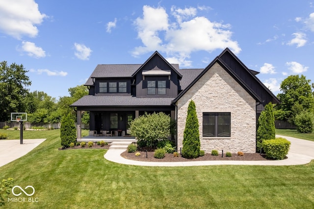 20440 Chatham Hills Blvd, Westfield, IN 46074 - view of front of home featuring stone siding, covered porch, and a front lawn