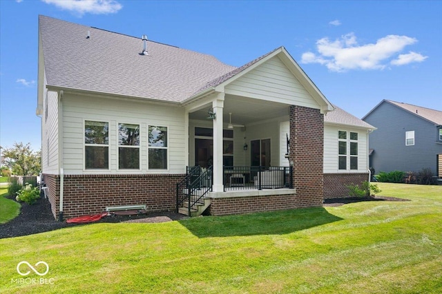 2840 Flowing Creek Pl, Westfield, IN 46074 - rear view of property featuring brick siding and a yard
