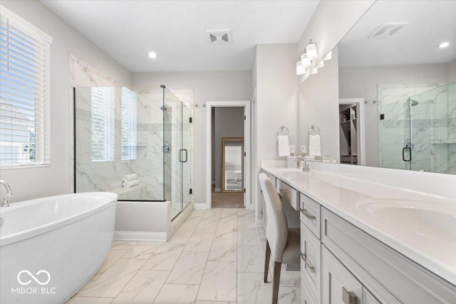 2840 Flowing Creek Pl, Westfield, IN 46074 - bathroom featuring a marble finish shower, a freestanding tub, double vanity, and recessed lighting
