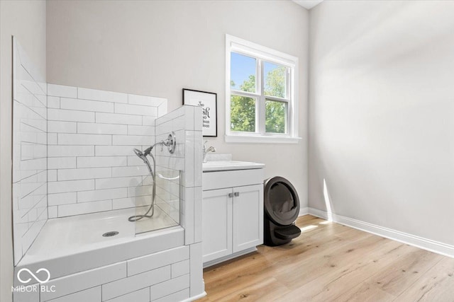 2840 Flowing Creek Pl, Westfield, IN 46074 - full bath featuring wood finished floors, vanity, and a tile shower