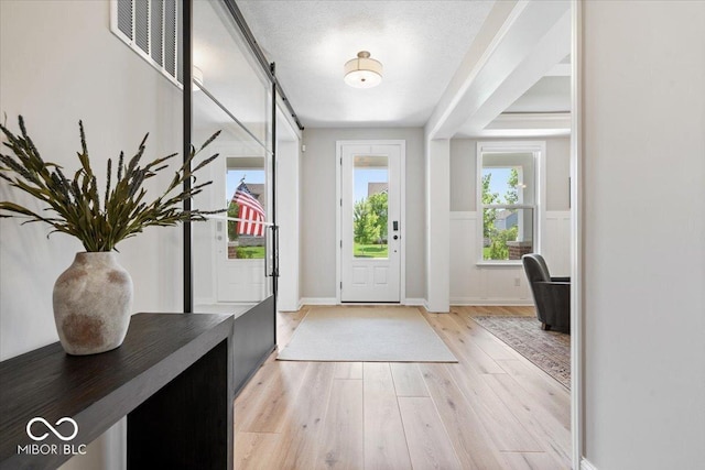 2840 Flowing Creek Pl, Westfield, IN 46074 - foyer entrance with light wood-type flooring and baseboards