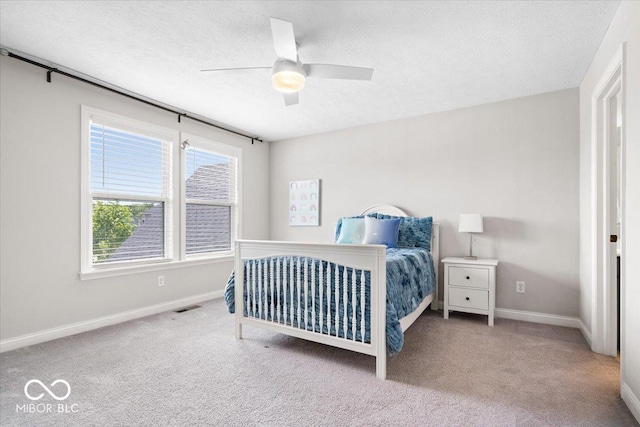 2840 Flowing Creek Pl, Westfield, IN 46074 - carpeted bedroom with a textured ceiling and a ceiling fan