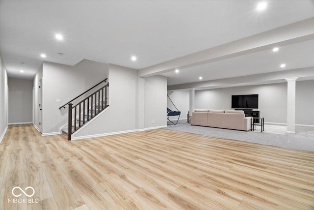 2840 Flowing Creek Pl, Westfield, IN 46074 - unfurnished living room featuring stairs, recessed lighting, and wood finished floors