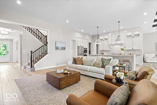 2840 Flowing Creek Pl, Westfield, IN 46074 - living room featuring light wood-style floors, stairway, and recessed lighting