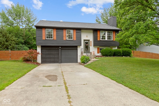 8418 Castle Farms Rd, Indianapolis, IN 46256 - bi-level home with concrete driveway, a garage, stucco siding, and a chimney