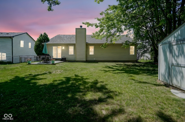 1804 Emerald Pines Ln, Westfield, IN 46074 - back of property featuring a chimney, a patio, and an outdoor structure