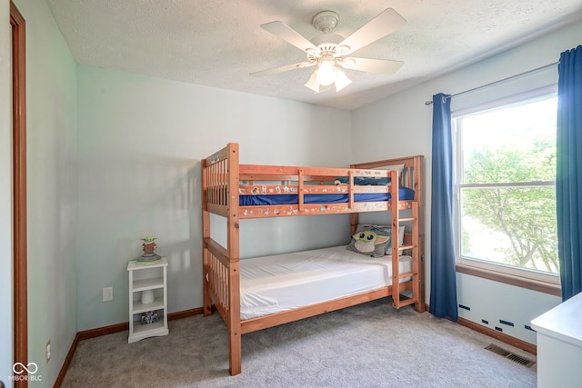 1804 Emerald Pines Ln, Westfield, IN 46074 - bedroom featuring carpet, multiple windows, a textured ceiling, and ceiling fan