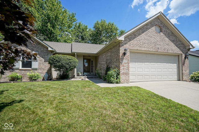 1804 Emerald Pines Ln, Westfield, IN 46074 - single story home with brick siding, concrete driveway, an attached garage, and a front yard