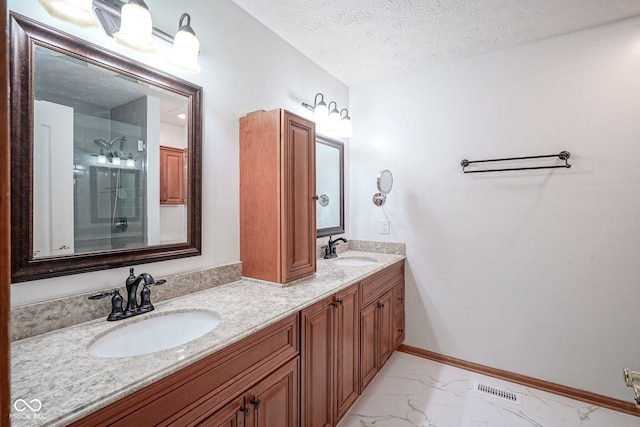 1804 Emerald Pines Ln, Westfield, IN 46074 - full bath featuring marble finish floors, double vanity, a textured ceiling, and an enclosed shower