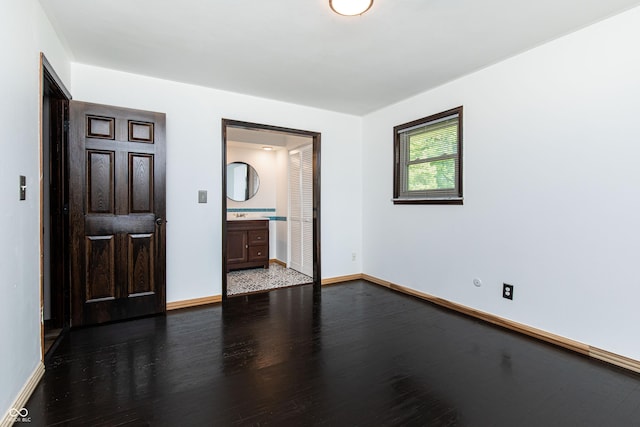 1202 E Stop 10th Rd, Indianapolis, IN 46227 - unfurnished bedroom featuring dark wood-style flooring and ensuite bathroom