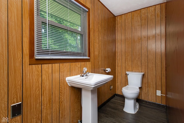 1202 E Stop 10th Rd, Indianapolis, IN 46227 - half bathroom with wooden walls and wood finished floors