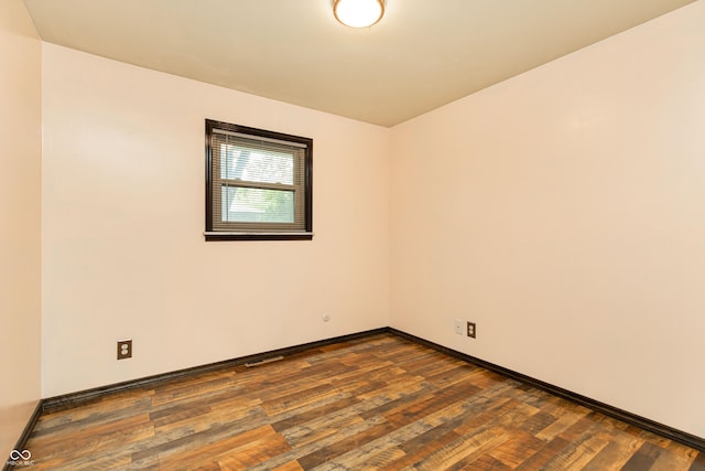 1202 E Stop 10th Rd, Indianapolis, IN 46227 - spare room featuring dark wood finished floors and baseboards