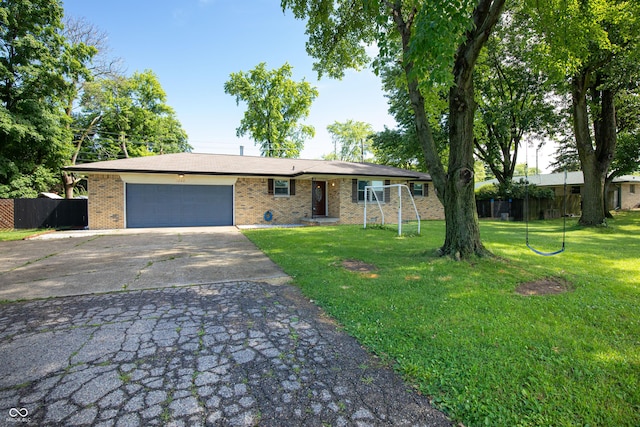 1202 E Stop 10th Rd, Indianapolis, IN 46227 - ranch-style house with brick siding, a garage, and driveway