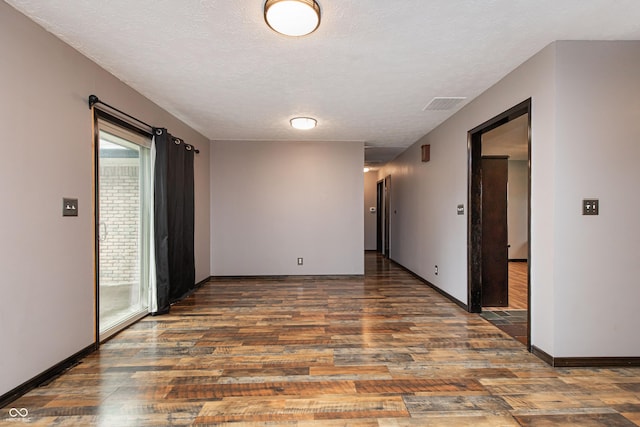 1202 E Stop 10th Rd, Indianapolis, IN 46227 - spare room with wood finished floors and a textured ceiling