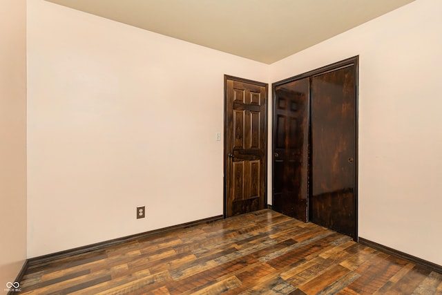 1202 E Stop 10th Rd, Indianapolis, IN 46227 - empty room featuring dark wood-type flooring and baseboards