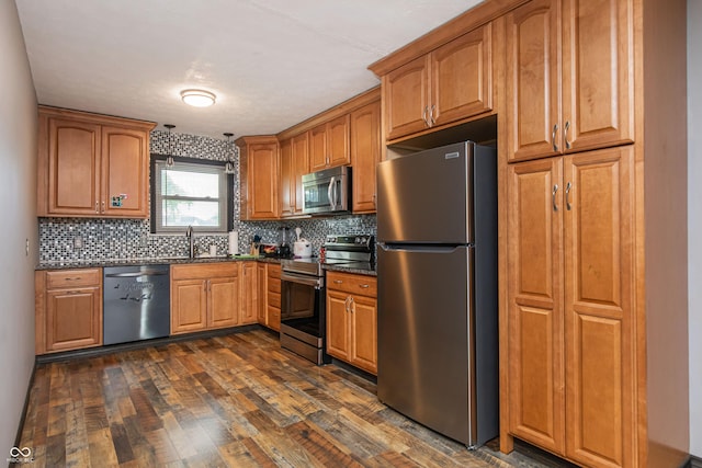 1202 E Stop 10th Rd, Indianapolis, IN 46227 - kitchen with stainless steel appliances, dark countertops, dark wood-style floors, and decorative backsplash