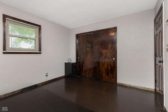 1202 E Stop 10th Rd, Indianapolis, IN 46227 - spare room featuring wood finished floors