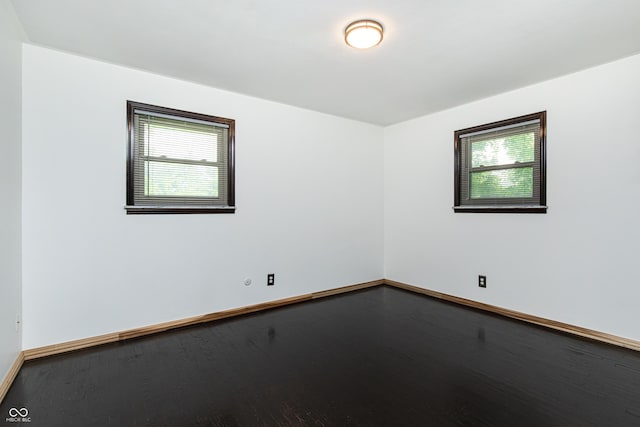 1202 E Stop 10th Rd, Indianapolis, IN 46227 - spare room with healthy amount of natural light and wood finished floors