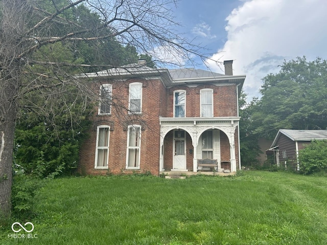 206 N 21st St, New Castle, IN 47362 - italianate-style house with a chimney, brick siding, covered porch, and a front yard