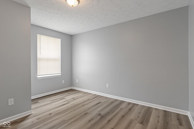 2359 Bremhaven Ct, Indianapolis, IN 46229 - spare room with wood finished floors and a textured ceiling