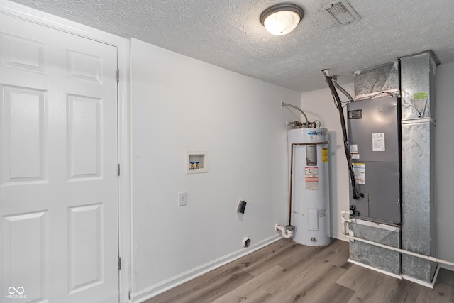 2359 Bremhaven Ct, Indianapolis, IN 46229 - utility room featuring electric water heater and heating unit