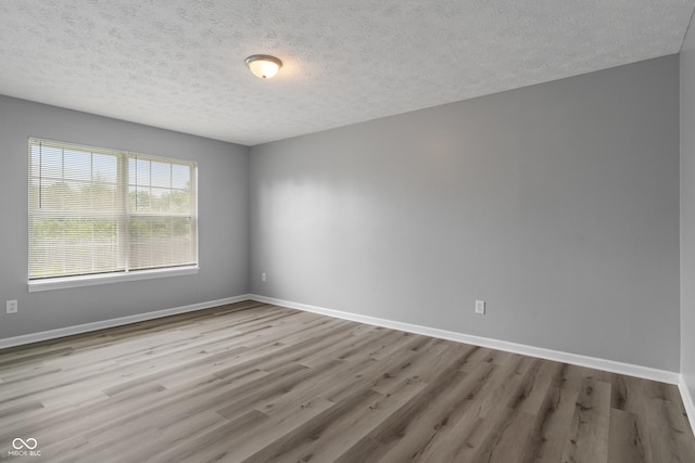 2359 Bremhaven Ct, Indianapolis, IN 46229 - empty room with wood finished floors and a textured ceiling